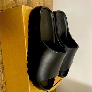 Gently used Adidas Yeezy slides in black